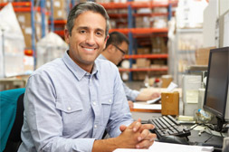 man sitting in front of a computer