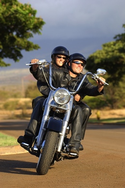 a man riding on the back of a motorcycle